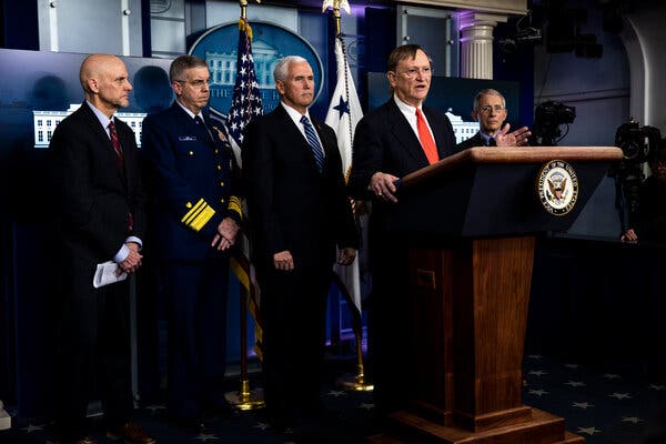 Dr. Robert Kadlec, who was with the Department of Health and Human Services under the Trump administration, appearing last March with members of the coronavirus task force.